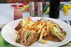 Club Sandwich with french fries  at Irma's Restaurant Bar - Cabo San Lucas